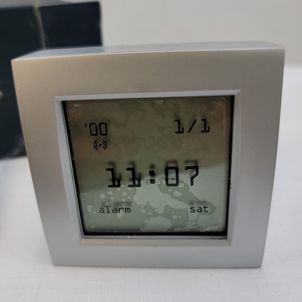 Brookstone Silver Upside Down World Clock Date Time Temp Alarm Battery Travel Sz